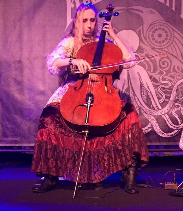 heather playing cello in front of an octopus